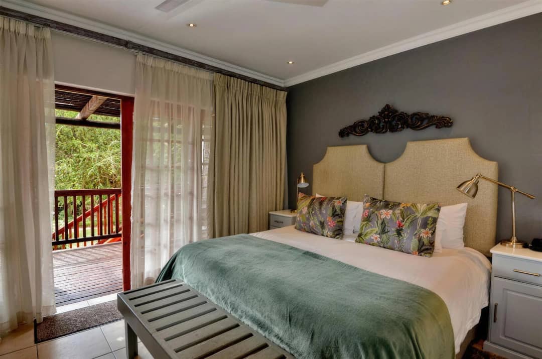 Crisp white bedding on a queen bed in the superior room