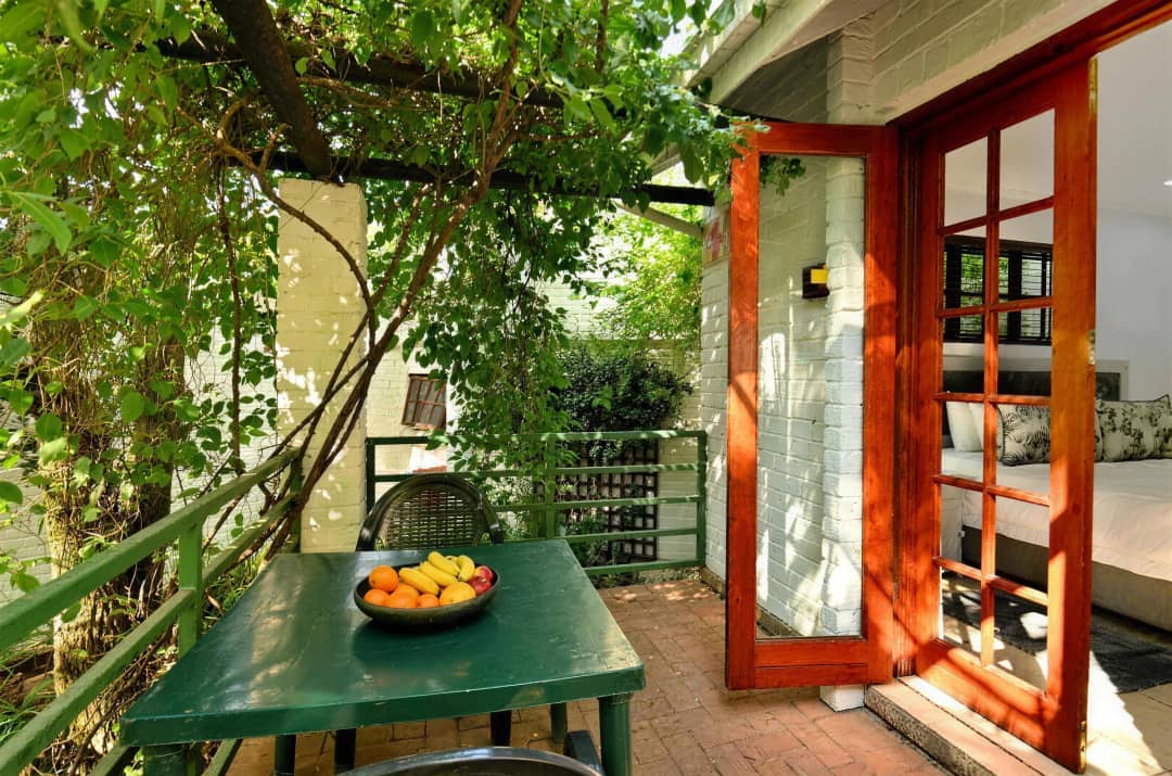 Private patio with a table outside the standard room's French doors