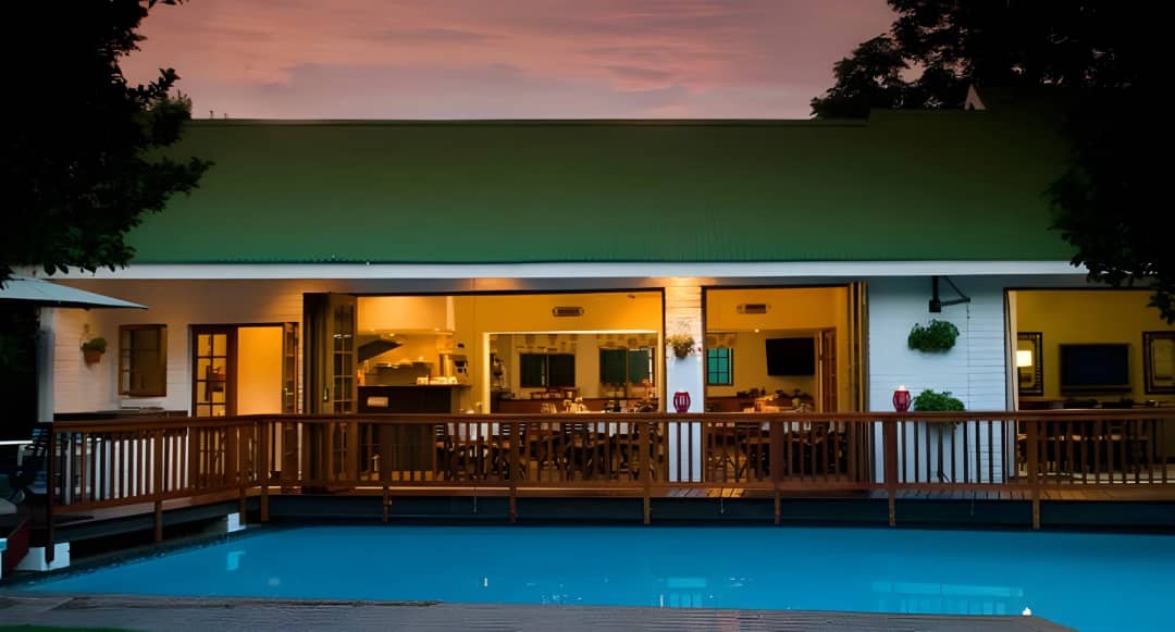 Evening view of restaurant across the pool