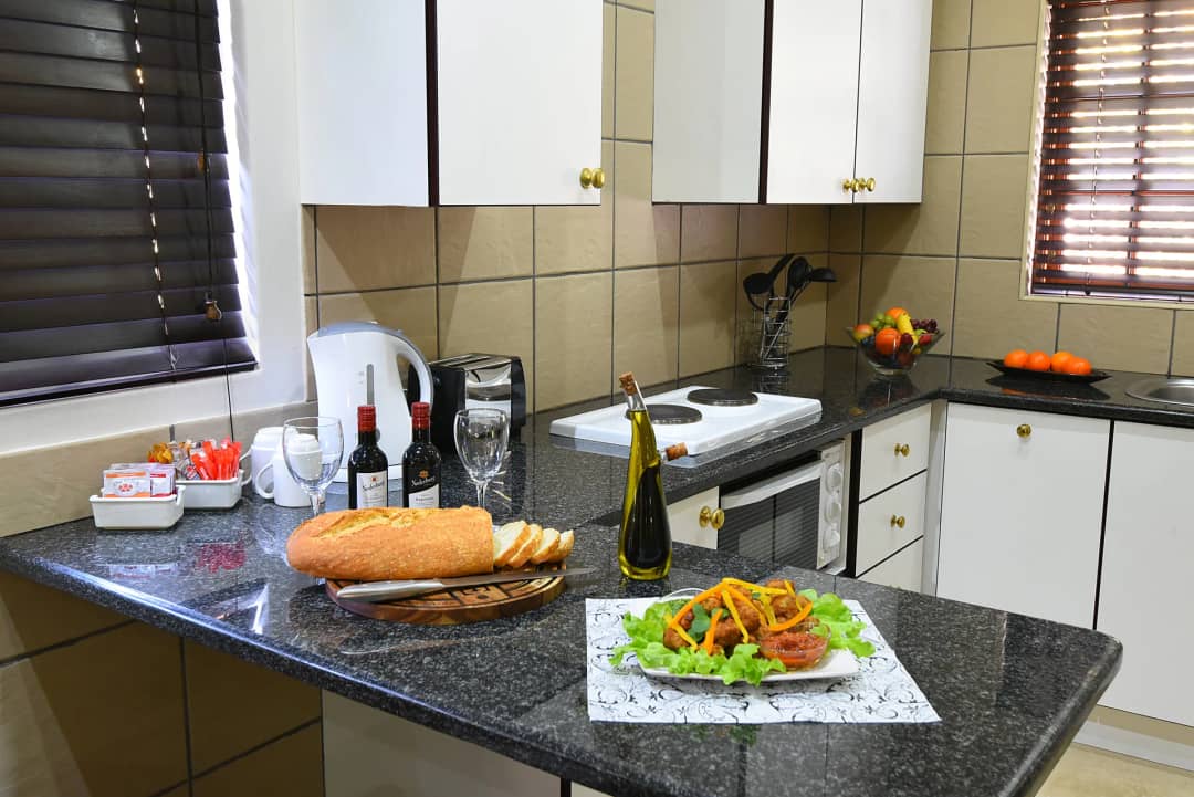 Kitchenette with a two-plate stove and a light meal laid out